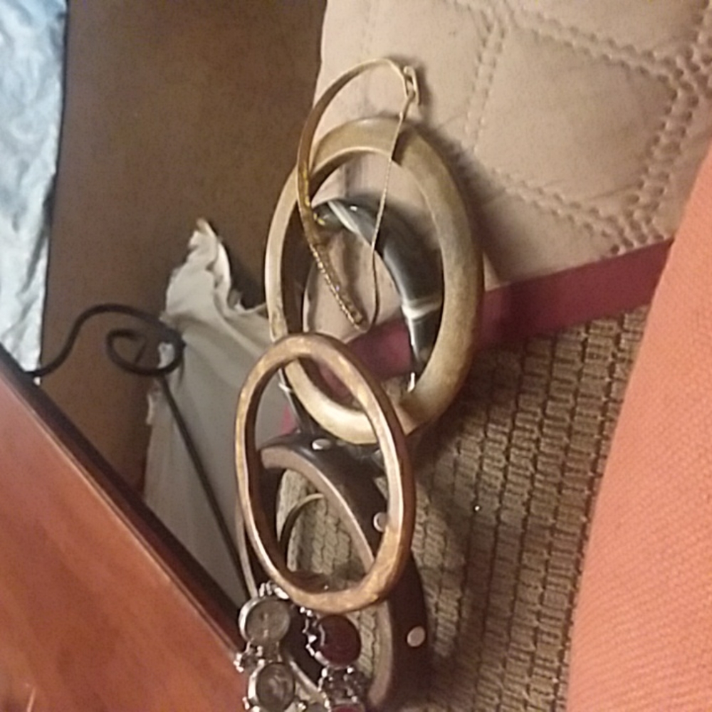 Brown  and gold bracelet  and red and purple  bow bracelet
